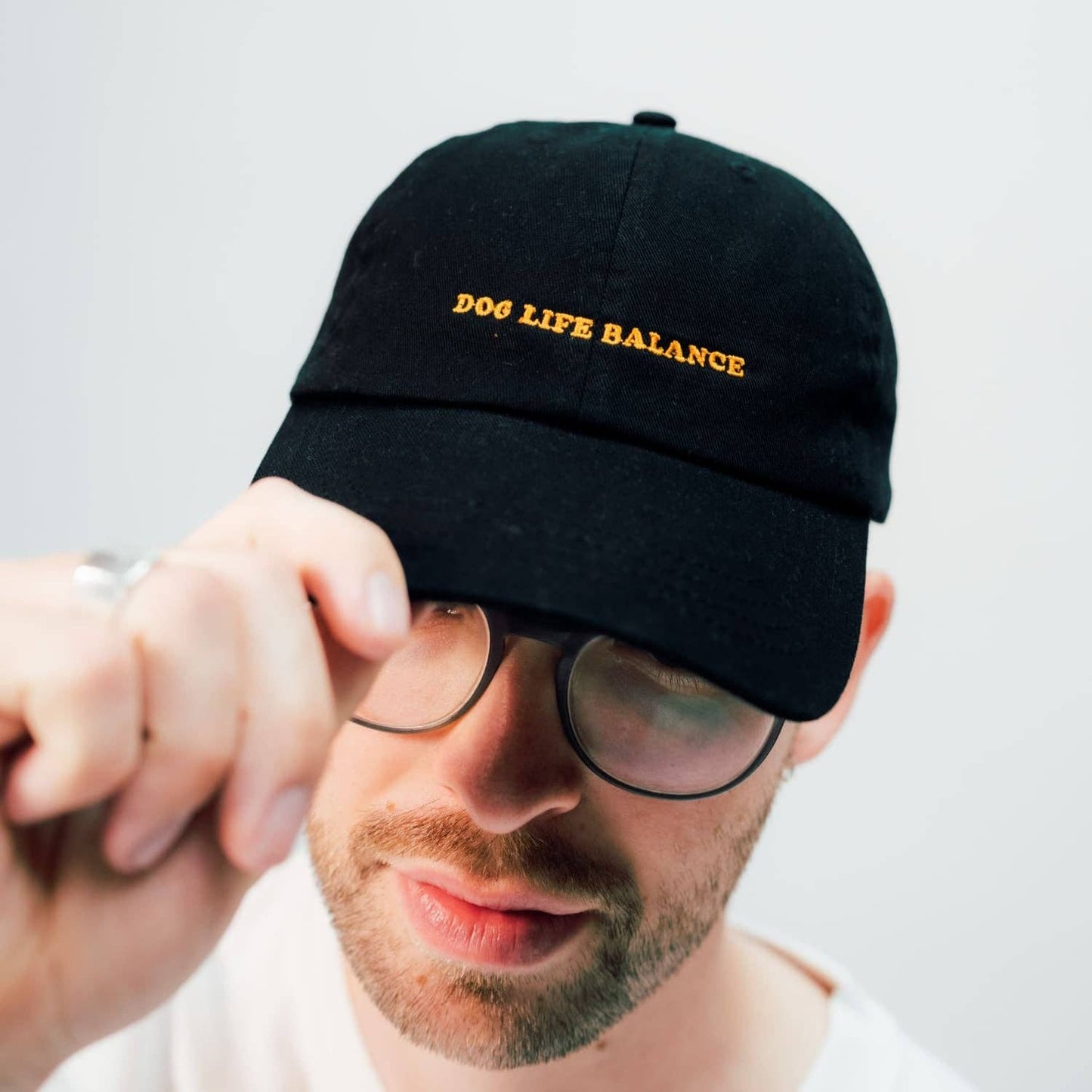 arrel - responsible apparel - Dog Life Balance Premium unisex dad cap - zwart en oranje